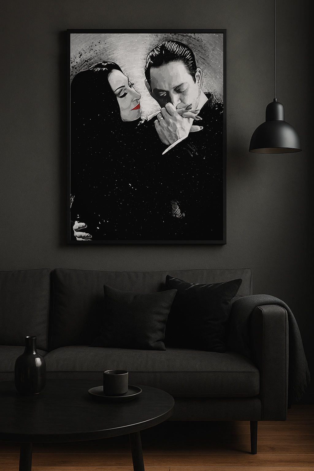 A framed black and white art print of a classic movie scene, featuring a woman with red lips and a man smoking a cigarette, displayed on a dark gray wall above a matching dark gray sofa in a moody room.