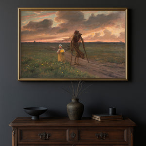 A framed art print depicting a dramatic landscape scene with a skeletal figure and a child under a cloudy sunset sky, displayed on a dark wall above a wooden console table with decorative objects.
